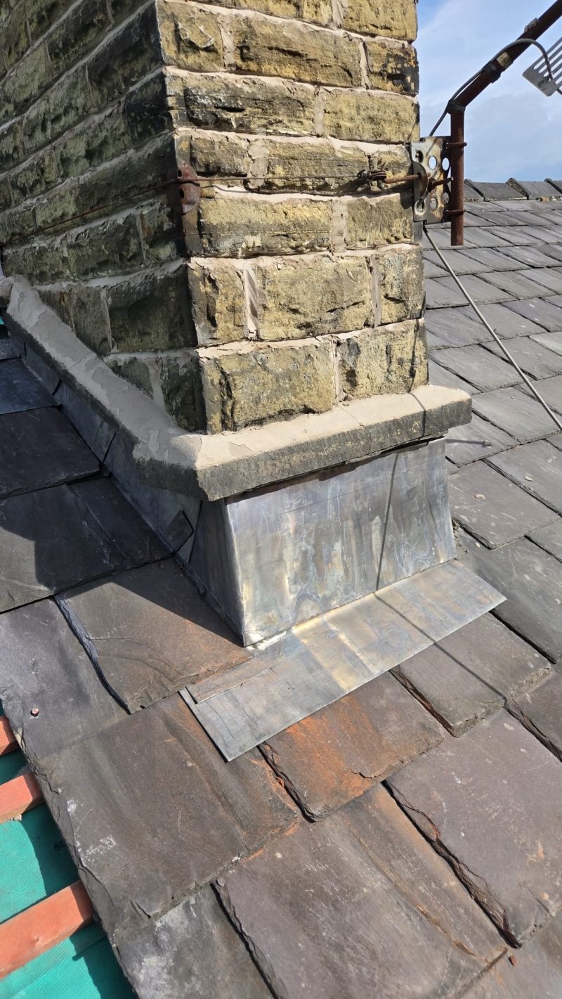 Fresh lead flashing dressed around a chimney stack on a period terrace