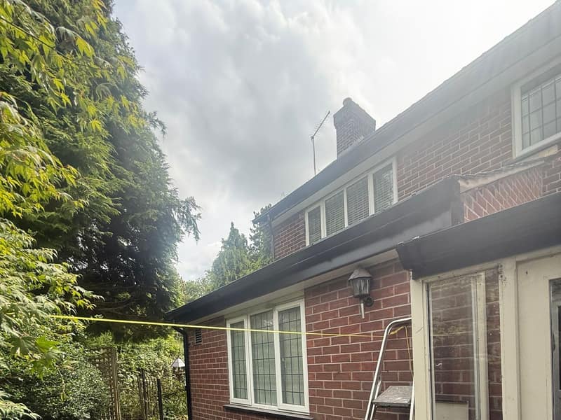 Completed uPVC roofline in black on an Adlington house, new fascia, soffit and guttering fitted throughout