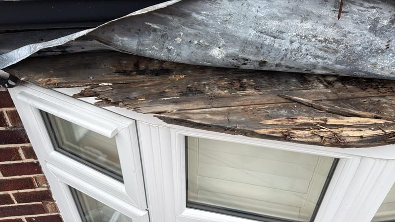Bay window roof stripped back to a fresh timber deck ready for new lead in Cheadle Hulme