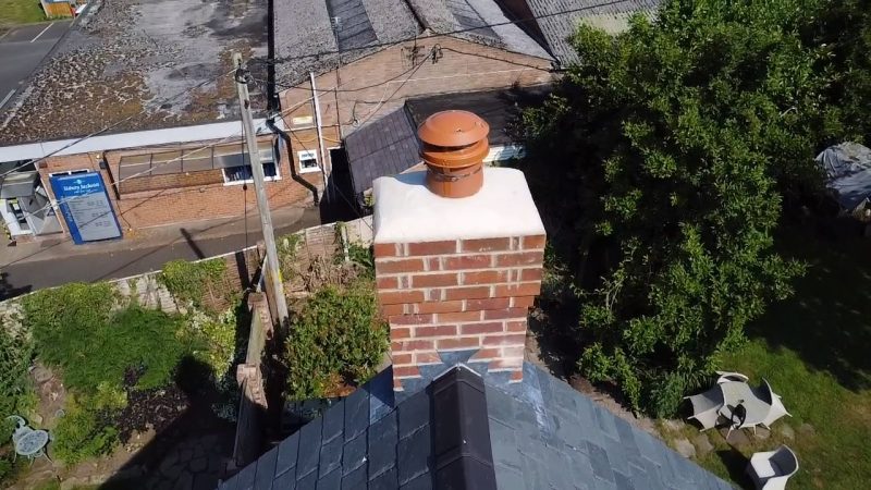 Rebuilt chimney stack with fresh lead flashing on a Wilmslow roof