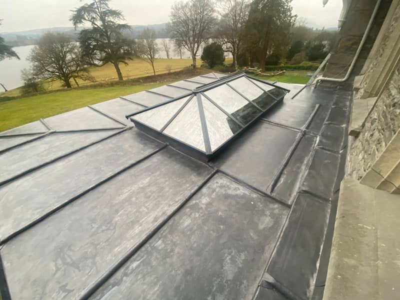 Close view of hand-dressed lead detailing on a Marple flat roof