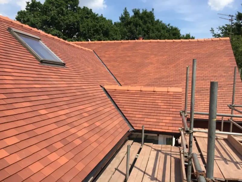New clay tiled roof installation with Velux window in Stockport