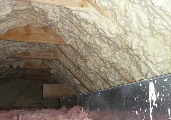 Closed cell spray foam sprayed across the whole underside of a pitched roof slope